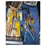 Tote of new and used hardware and tools