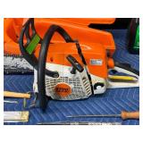 Stihl Chainsaw with approximately 2 gal bar oil and 1 gal bar oil and accessories
