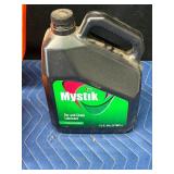 Stihl Chainsaw with approximately 2 gal bar oil and 1 gal bar oil and accessories