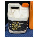 Stihl Chainsaw with approximately 2 gal bar oil and 1 gal bar oil and accessories