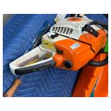 Stihl Chainsaw with approximately 2 gal bar oil and 1 gal bar oil and accessories