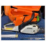 Stihl Chainsaw with approximately 2 gal bar oil and 1 gal bar oil and accessories
