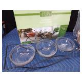 New pottery casserole wiyh plastic lid and metal rack and 3 glass bowl condiment set with metal rack