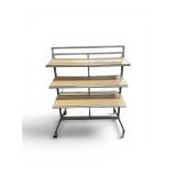 retail merchandising island gondola display unit featuring a chrome steel frame and wood-finished shelving