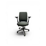 Steelcase Amia office chair featuring adjustable arms and a gray fabric seat