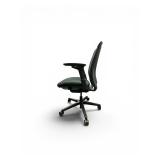 Steelcase Amia office chair featuring adjustable arms and a gray fabric seat