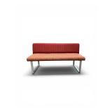 Esto soft seating bench features a unique two-tone design with a patterned yellow back and an orange seat Retails for $1200