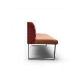 Esto soft seating bench features a unique two-tone design with a patterned yellow back and an orange seat Retails for $1200