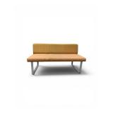 Esto soft seating bench features a unique two-tone design with a patterned yellow back and an orange seat Retails for $1200