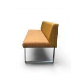 Esto soft seating bench features a unique two-tone design with a patterned yellow back and an orange seat Retails for $1200