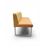 Esto soft seating bench features a unique two-tone design with a patterned yellow back and an orange seat Retails for $1200