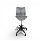 Herman Miller Cosm Drafting stool featuring a sleek, armless design with a breathable mesh back and seat