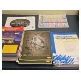 assortment of History workbooks and study guides
