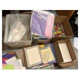 construction paper, various new packs of paper, tissue paper, and clear bags