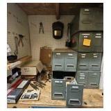 shelf of welding supplies and measuring instruments