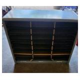 metal mailbox with cardboard shelving