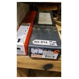 shelf of welding supplies and measuring instruments