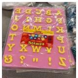 brand new bags of fabric, paint, paper towels, fabric, and letter stamps