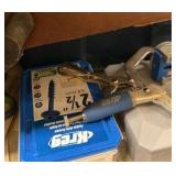 shelf of multimeter light switches nails in tote of leather materials