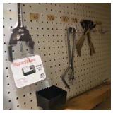 shelf of welding supplies and measuring instruments