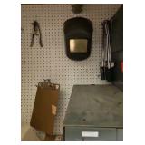 shelf of welding supplies and measuring instruments