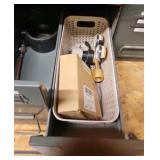 shelf of welding supplies and measuring instruments