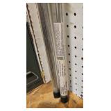 shelf of welding supplies and measuring instruments
