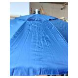 Tommy Bahama Groundbreaker 7ft beach umbrella with a blue fabric.