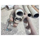 Exhaust manifold with a turbocharger attached, along with various 4" straight and bent pipes, a muffler or resonator, and a tailpipe tip.