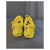 These fluorescent yellow running sneakers feature a distinct blade-style cushioned sole and breathable mesh upper. Size 13