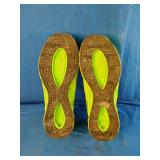 These fluorescent yellow running sneakers feature a distinct blade-style cushioned sole and breathable mesh upper. Size 13