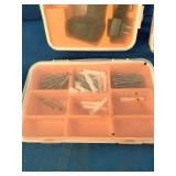 Collection of household hand tools, a cordless drill, and various wall anchors, screws, and nails organized