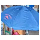 Tommy Bahama Groundbreaker 7ft beach umbrella with a blue fabric.
