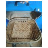 Americana Walk-A-Bout portable charcoal grill in blue.