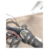 Maroon Specialized Hotrock 24 mountain bike with 24-inch wheels.