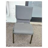 (11) Stackable metal-frame chairs featuring gray, cushioned seats and backs