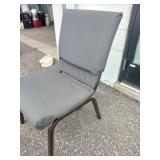 (11) Stackable metal-frame chairs featuring gray, cushioned seats and backs