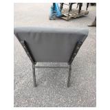 (11) Stackable metal-frame chairs featuring gray, cushioned seats and backs