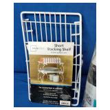 (2) Celebrate brand confetti popper, (2)  Mainstays Short Stacking Shelf, and A rubber straining mat