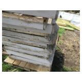 Half pallet base with stacks of woo...