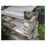 Stack of 9 wood half size pallets...