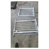 Two White Metal Safety Gates