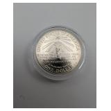 90% Silver 1986 Ellis Island Commemorative Dollar Coin in Capsule