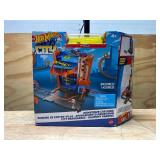 Hot Wheels City Toy Car Track Set, Downtown Car Park Playset with 1:64 Scale Vehicle, 4 Levels, Working Lift & Exit Chute