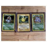 Lot of 3 Pokemon Trading Cards Featuring Dark Arbok HOLO, Pikachu, and Nidoking