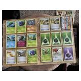 Lot of Pokemon Trading Cards including Tangela, Karrablast, Shellos, and Assorted Trainer and Energy Cards