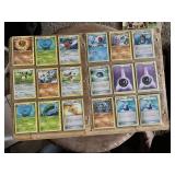 Lot of Pokemon Trading Cards including Tangela, Karrablast, Shellos, and Assorted Trainer and Energy Cards