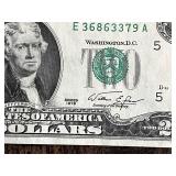 Three United States $2 bills Two are from the 1976 series, and one is from the 2009 series