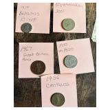 1974 Bahamas 10 Cent, 1967 Great Britain Penny, 1970 Un Peso, 1956 Centavos, 2001 Guatemalan coin and 1000 Italian Lire banknote.