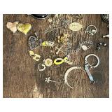 Assorted Charms and Pendants Including Crosses, Hearts, and Symbols
